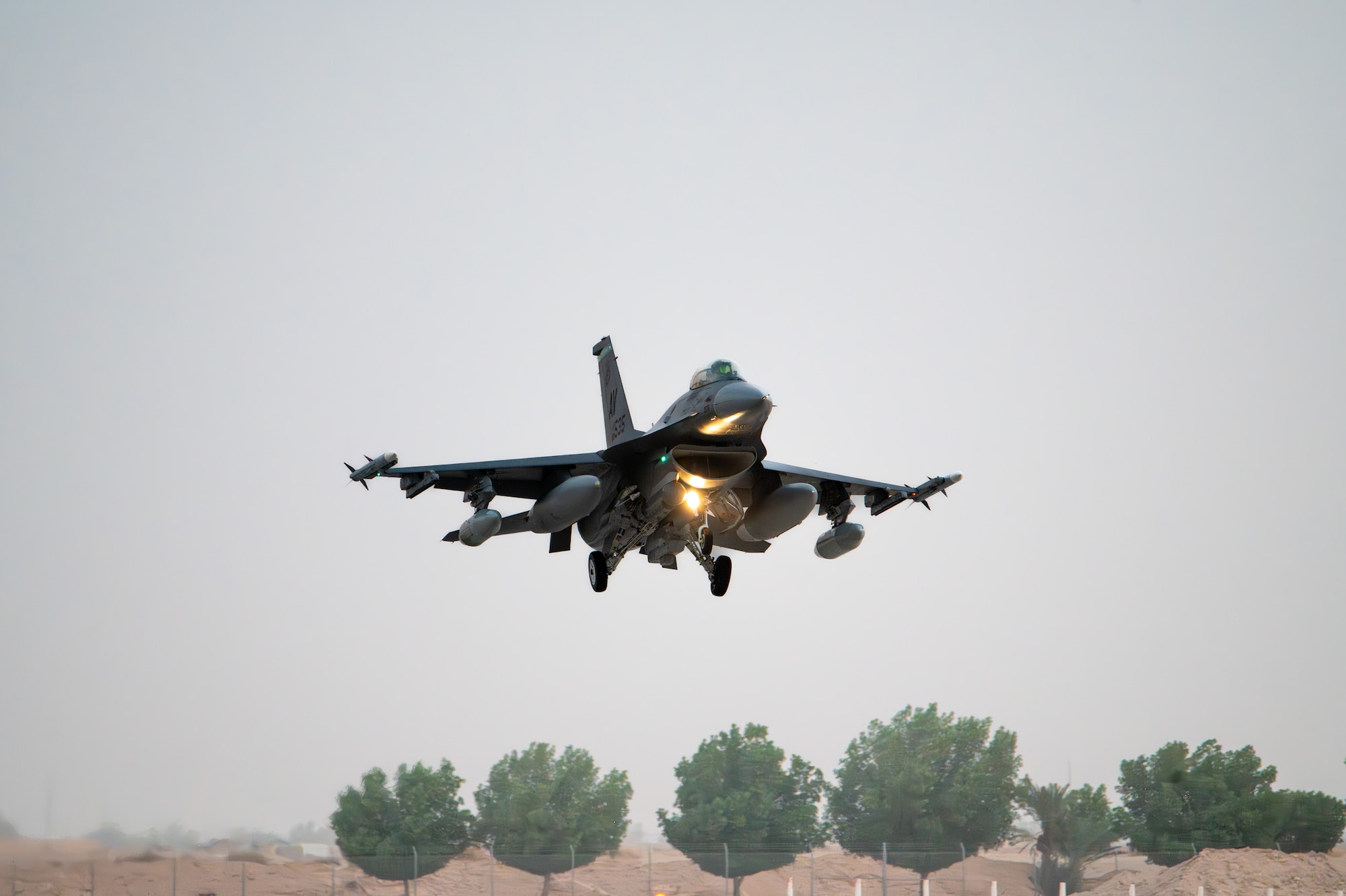 A U.S. Air Force F-16C Fighting Falcon assigned to the 555th Expeditionary Fighter Squadron prepares to land.