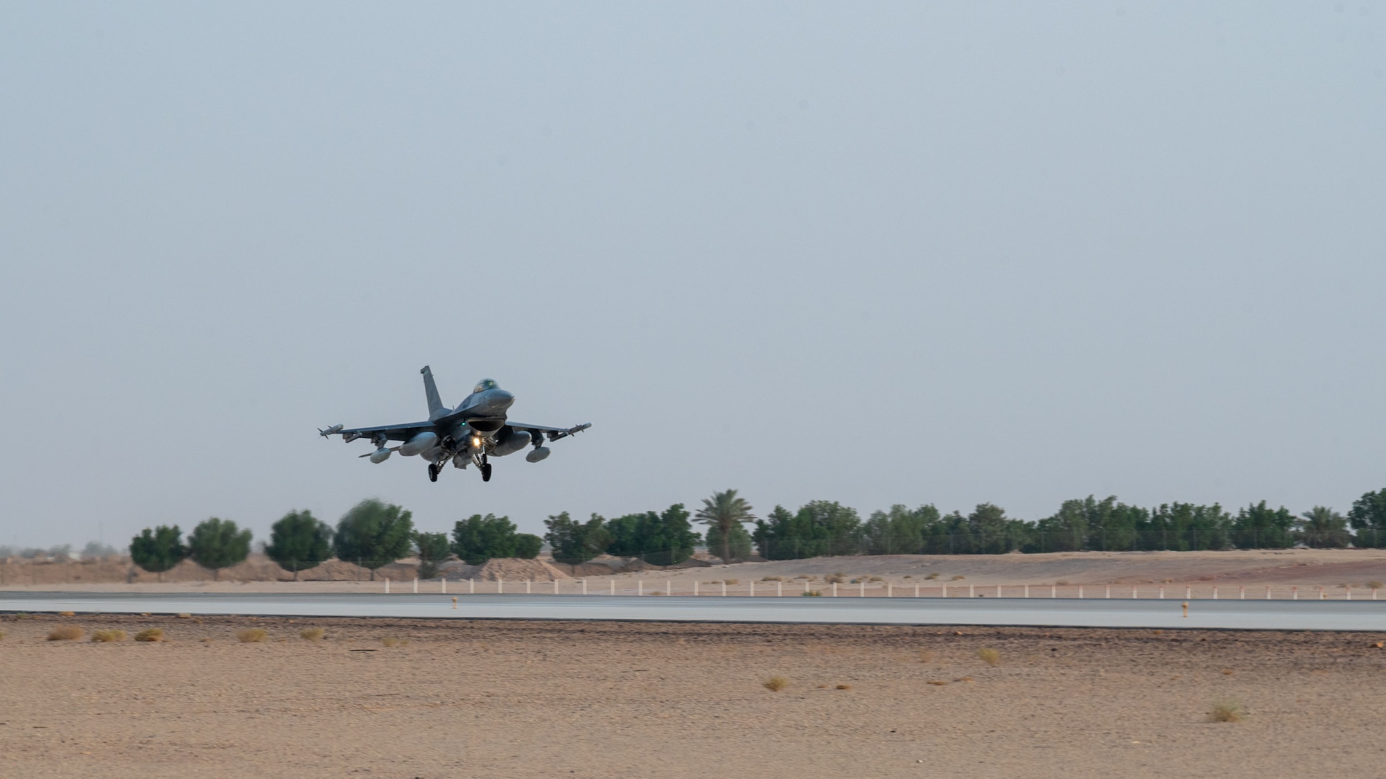 A U.S. Air Force F-16C Fighting Falcon assigned to the 555th Expeditionary Fighter Squadron prepares to land.