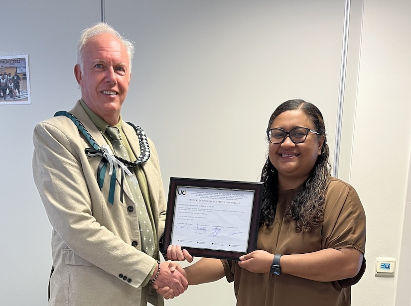 Bernard Jaye, the safety officer for Logistics Readiness Center Benelux, 405th Army Field Support Brigade, is presented with his Belgian Safety Certification Qualification Level II certificate from Diana Ioane, the director of LRC Benelux, at her office June 30, 2025. (U.S. Army courtesy photo)