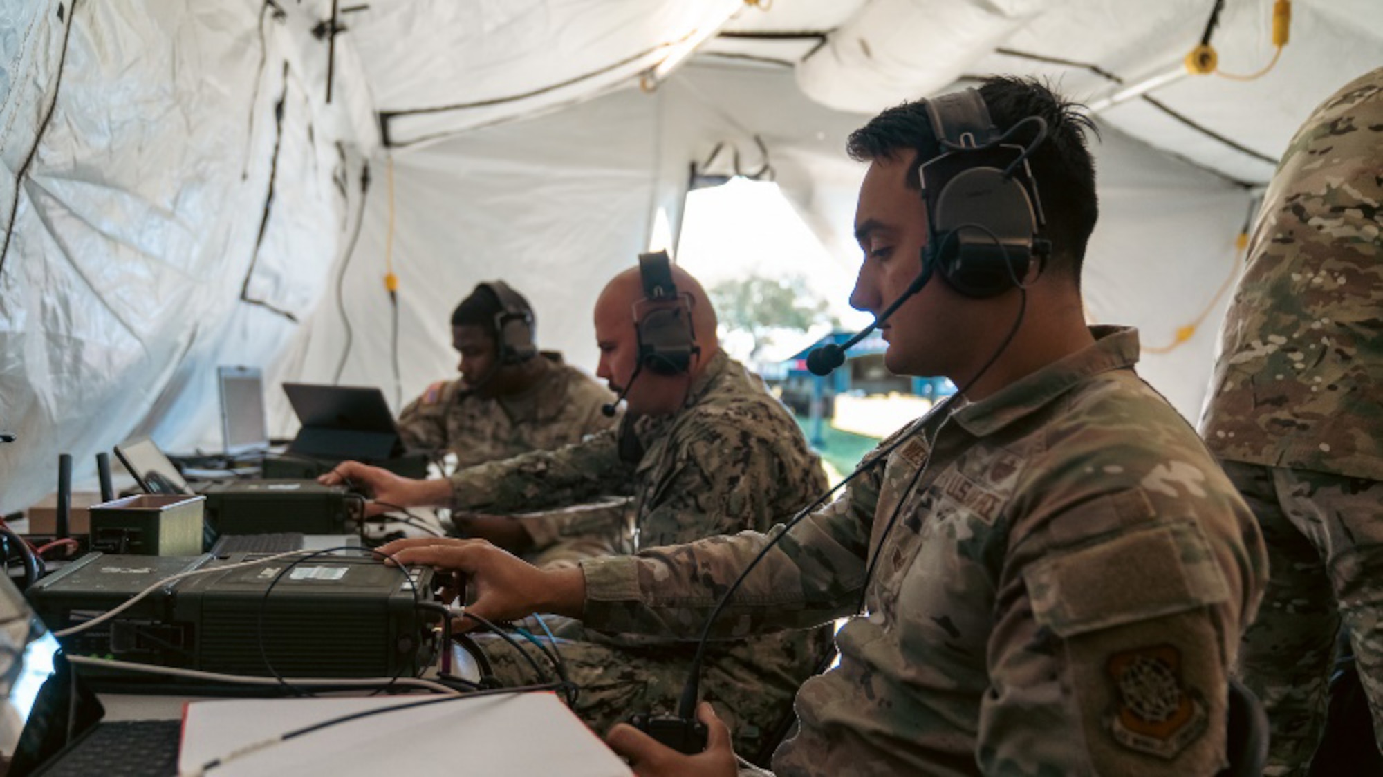 Joint communications systems technicians assigned to the 2nd Joint Communications Squadron Element monitors multiple radios during the annual U.S. Army Network Enterprise Technology Command, open-source software defined radio High Frequency Radio Competition, from March 20-22, 2025, at MacDill Air Force Base, Florida. NETCOM QPRX HF 2025 Competition is a low power (20 Watts) competition sticking to a contest-based format with points awarded for achieving various criteria. JCSE is a unit within the Department of Defense that provides quick response deployable teams, specializing in communication to support various missions. (U.S. Army photo)