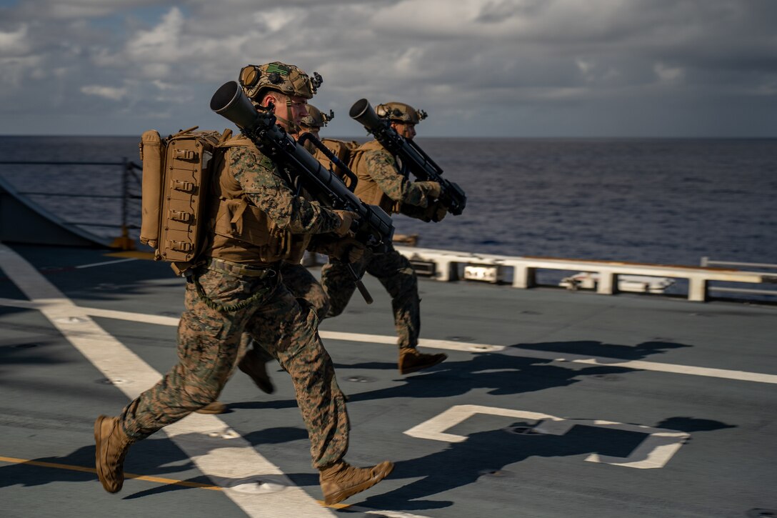 U.S. Marines with India Company, Battalion Landing Team 3/6, 22nd Marine Expeditionary Unit (Special Operations Capable) bound forward while conducting support by fire drills during Composite Training Unit Exercise, aboard the San Antonio-class amphibious transport dock USS Fort Lauderdale (LPD 28), Iwo Jima Amphibious Ready Group, while underway in the Atlantic Ocean, June 30, 2025. During COMPTUEX, the IWOARG and 22nd MEU (SOC) refine tactics, techniques, and procedures to execute warfighting functions that enhance operational readiness and lethality as a unified IWOARG/22 MEU (SOC) team. (U.S. Marine Corps photo by Lance Cpl. Kyle Baskin)