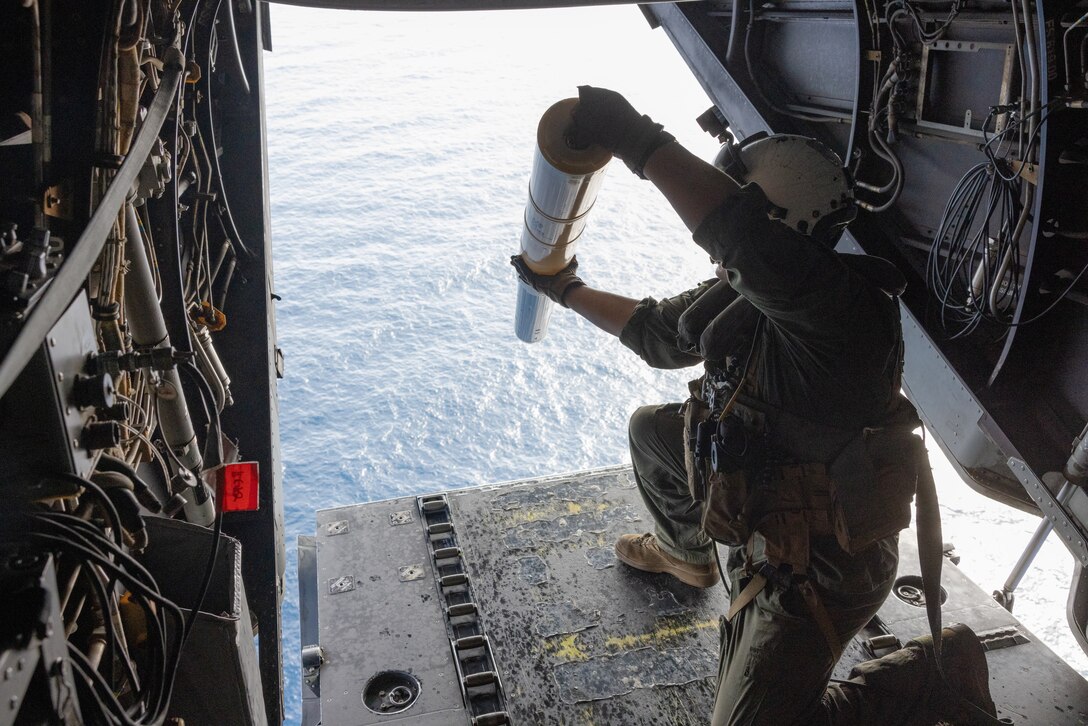 U.S. Marine Corps Sgt. Victor Estes, from Alabama, an MV-22B Osprey crew chief with Marine Medium Tiltrotor Squadron (VMM) 162, drops sonobuoys out of an MV-22B Osprey during a flight near Surface Combat Systems Center Wallops Island, Virginia, July 2, 2025. Atlantic Alliance 2025 (AA25) is the premier East Coast naval integration exercise, featuring over 25 U.S. Navy and Marine Corps units alongside Dutch naval forces and British Royal Commandos. Spanning from North Carolina to Maine, AA25 will showcase a range of dynamic events including force integration, air assault operations, bilateral reconnaissance, naval strait transits, amphibious assault training, and a simulated war-at-sea exercise. (U.S. Marine Corps photo by Lance Cpl. Orlanys Diaz Figueroa)
