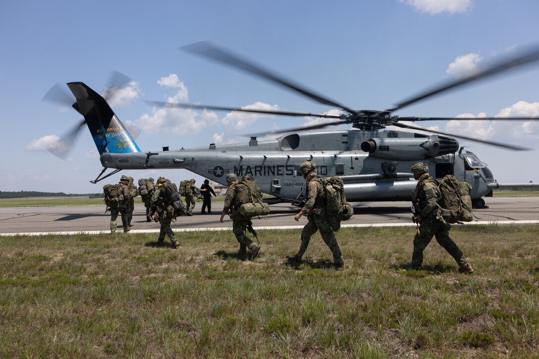 U.S. Marines with Marine Heavy Helicopter Squadron (HMH) 464 lead Royal Netherlands Marines to a CH-53E Super Stallion during Atlantic Alliance 2025 near the coast of New Jersey, July 3, 2025. Atlantic Alliance 2025 (AA25) is the premier East Coast naval integration exercise, featuring over 25 U.S. Navy and Marine Corps units alongside Dutch naval forces and British Royal Commandos. Spanning from North Carolina to Maine, AA25 will showcase a range of dynamic events including force integration, air assault operations, bilateral reconnaissance, naval strait transits, amphibious assault training, and a simulated war-at-sea exercise. (U.S. Marine Corps photo by Cpl. Anakin Smith)