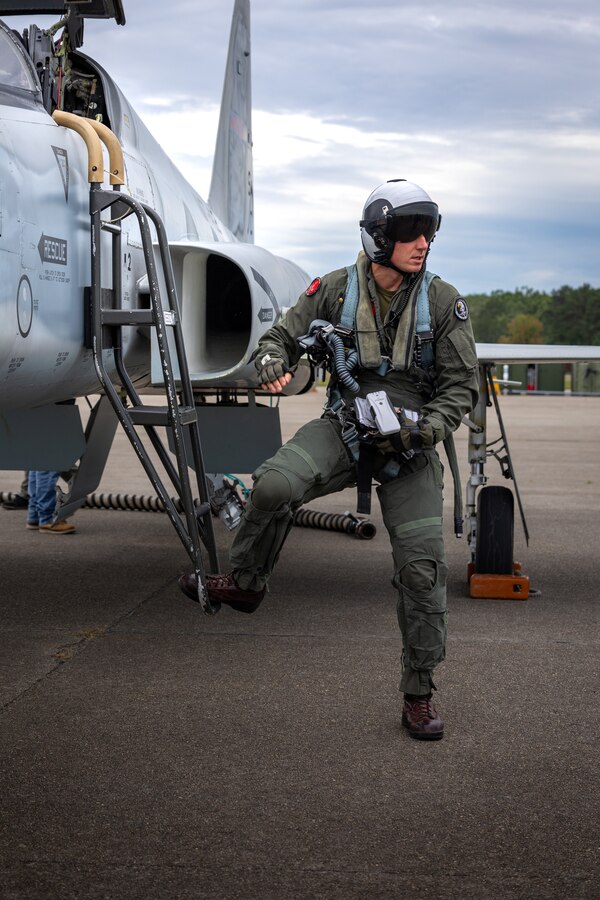 U.S. Marine Corps Maj. John J. Carter, an aircraft maintenance officer with Marine Fighter Training Squadron (VMFT) 402, steps off an F-5N Tiger II aircraft during Atlantic Alliance 2025 at Joint Base Cape Cod, Massachusetts, July 2, 2025. VMFT-402’s purpose in Atlantic Alliance is to support and enhance Navy-Marine Corps amphibious operations by providing advanced fighter training and integrating air combat capabilities into joint and allied exercises along the East Coast. (U.S. Marine Corps photo by Sgt. Emely Gonzalez)