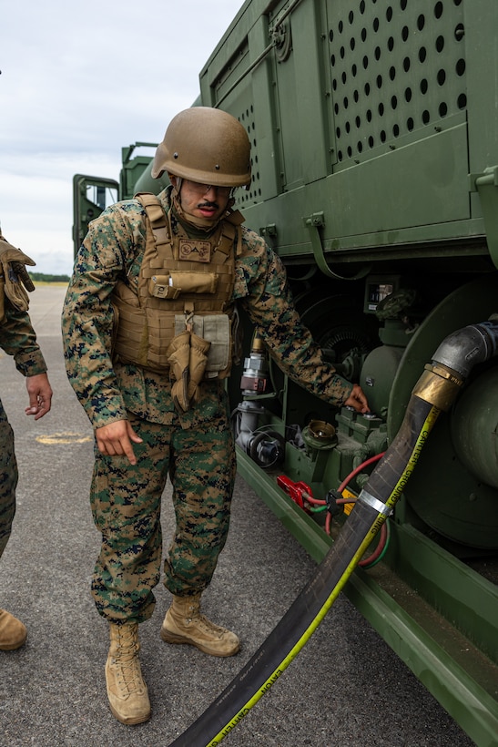In Flight and Fuel: Marine Pilots fly an F-5 in Joint Base Cape Cod