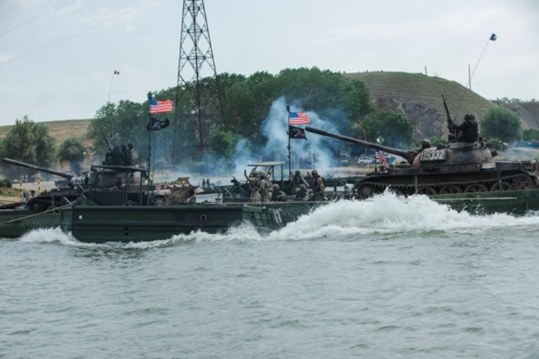 U.S. Soldiers assigned to the 7th Engineer Brigade, 21st Theater Sustainment Command, transports Italian VBM Freccia at a wet gap crossing during exercise Saber Guardian 25 in Frecatei, Romania, June 12, 2025. ERDC researchers worked closely with Soldiers in Romania as part of an experiment focused on improving tactics, techniques and procedures for Warfighters conducting wet gap crossings.