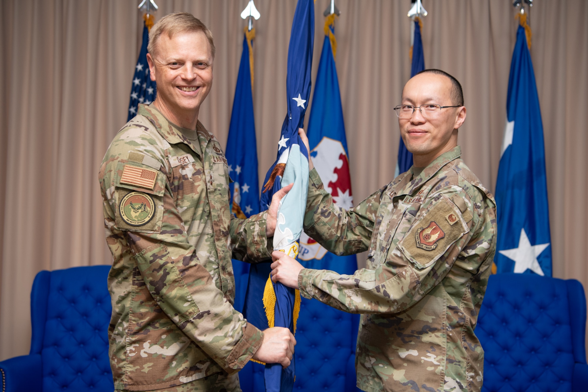 HANSCOM, AIR FORCE BASE, Mass., (June 24, 2025) – Maj. Gen. Luke Cropsey, left, appoints Col. Alan Louie as the Aerial Networks Division’s senior materiel leader at the Hanscom Minuteman Commons, here, June 24, 2025. The division recently realigned under Department of the Air Force’s Program Executive Office for Command, Control, Communications and Battle Management. The division’s mission is to deliver, sustain and support combat-effective, multi-domain communication capabilities. Cropsey is C3BM’s program executive officer. (Official Air Force Photo by Jerry Saslav).