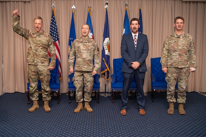 (From left to right) Maj. Gen. Luke Cropsey, Col. Alan Louie, Jeremy Thiele, and Col. Thomas Ward participate in the Aerial Networks Division change of leadership ceremony at the Hanscom Minuteman Commons, here, June 24, 2025. During the ceremony Ward relinquished his position as the division’s senior materiel leader to Louie. The division recently realigned under Department of the Air Force’s Program Executive Office for Command, Control, Communications and Battle Management. Cropsey is C3BM’s program executive officer. Thiele is the acting PEO for the DAF PEO Cyber and Networks Directorate. (Official Air Force Photo by Jerry Saslav).