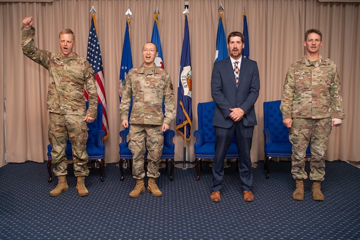 (From left to right) Maj. Gen. Luke Cropsey, Col. Alan Louie, Jeremy Thiele, and Col. Thomas Ward participate in the Aerial Networks Division change of leadership ceremony at the Hanscom Minuteman Commons, here, June 24, 2025. During the ceremony Ward relinquished his position as the division’s senior materiel leader to Louie. The division recently realigned under Department of the Air Force’s Program Executive Office for Command, Control, Communications and Battle Management. Cropsey is C3BM’s program executive officer. Thiele is the acting PEO for the DAF PEO Cyber and Networks Directorate. (Official Air Force Photo by Jerry Saslav).