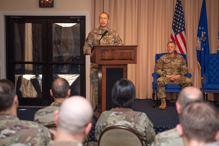 Col. Alan Louie speaks during the the Aerial Networks Division’s change of leadership ceremony at the Hanscom Minuteman Commons, here, June 24, 2025. During the ceremony Col. Thomas Ward relinquished his position as the division’s senior materiel leader to Louie. The division recently realigned under Department of the Air Force’s Program Executive Office for Command, Control, Communications and Battle Management. The division’s mission is to deliver, sustain and support combat-effective, multi-domain communication capabilities. (Official Air Force Photo by Jerry Saslav).