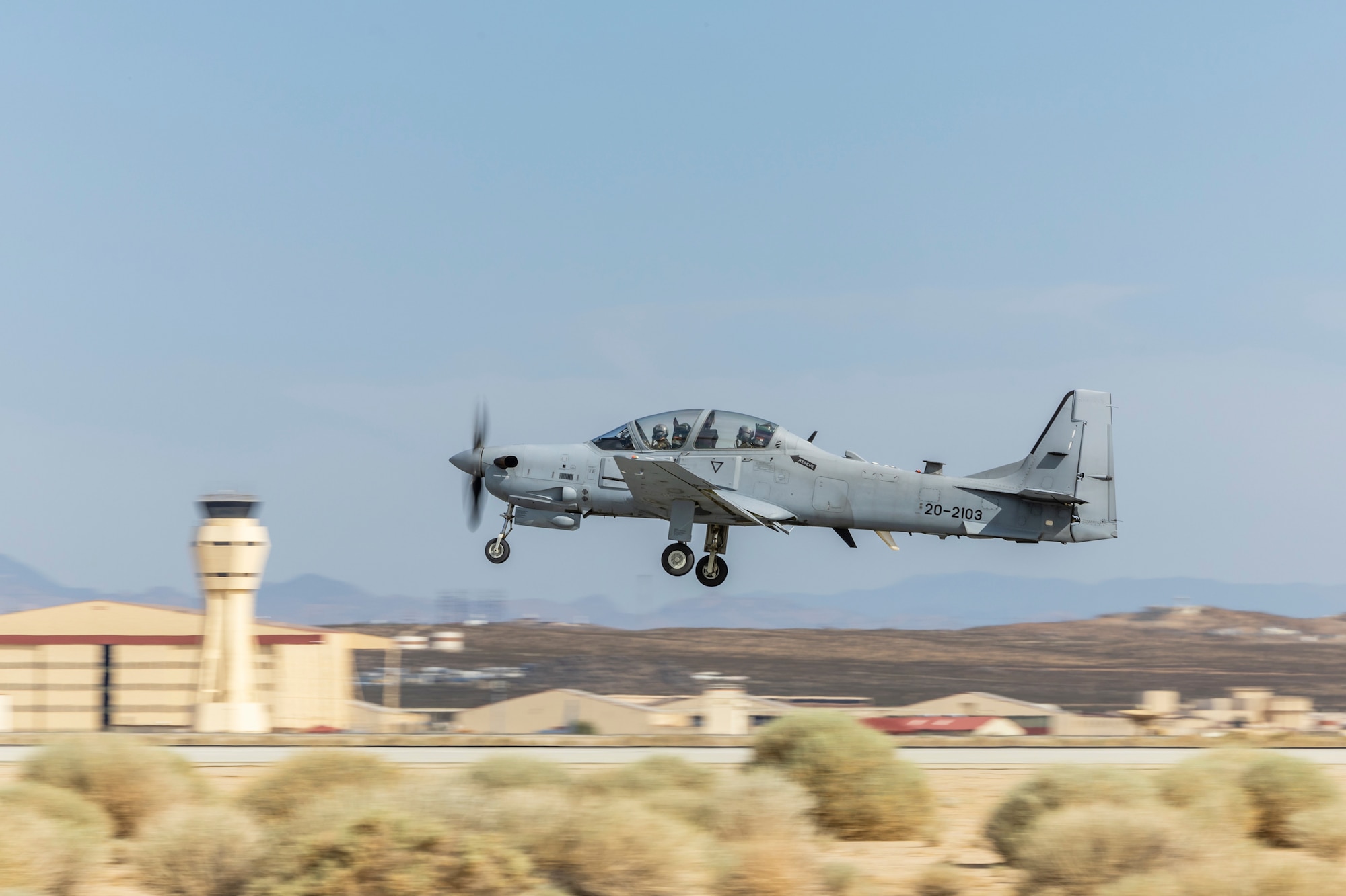Instructors at Air Force Test Pilot School depart Edwards Air Force Base in California during an A-29C training flight. The A-29C Super Tucano fleet has begun formal integration into school's curriculum. This new aircraft provides students with a modern platform for instruction in aerial spins, sensors and mission systems training, while also giving the school an additional aircraft type for data collection during research projects. (Air Force photo by James West)