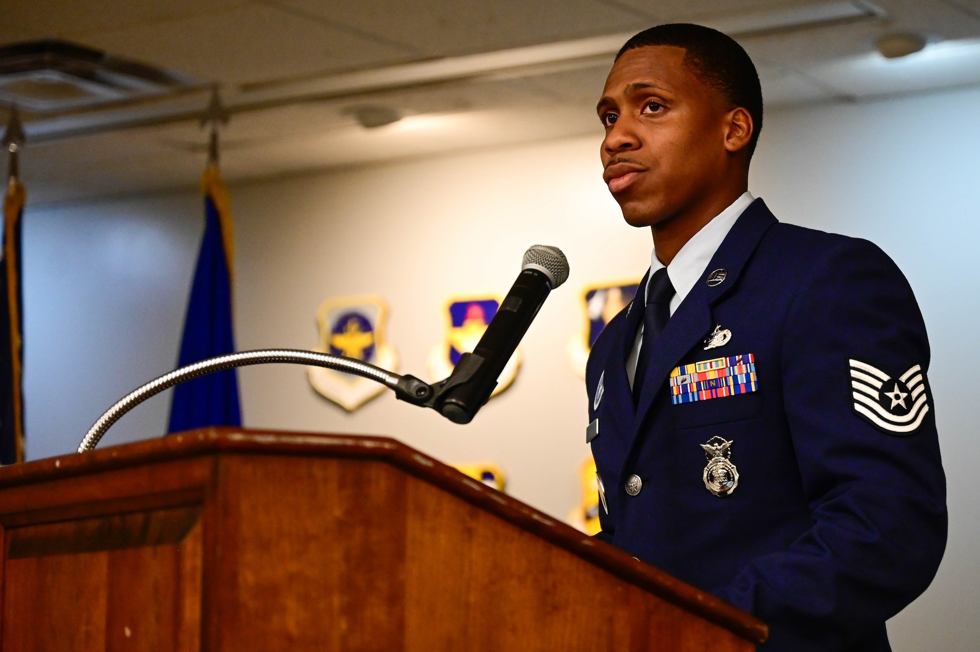 Man stands at podium.