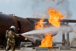 U.S. Air Force Tech. Sgt. Anthony Gonzalez, fire protection craftsman assigned to the 156th Civil Engineer Squadron, Puerto Rico Air National Guard, extinguishes a fire during a Deployment for Training (DFT) at Aviano Air Base, Italy, June 25, 2025. During the DFT, the 156th CES developed their skill proficiency in a new area of responsibility while supporting real-world projects that support the U.S. European Command operations.