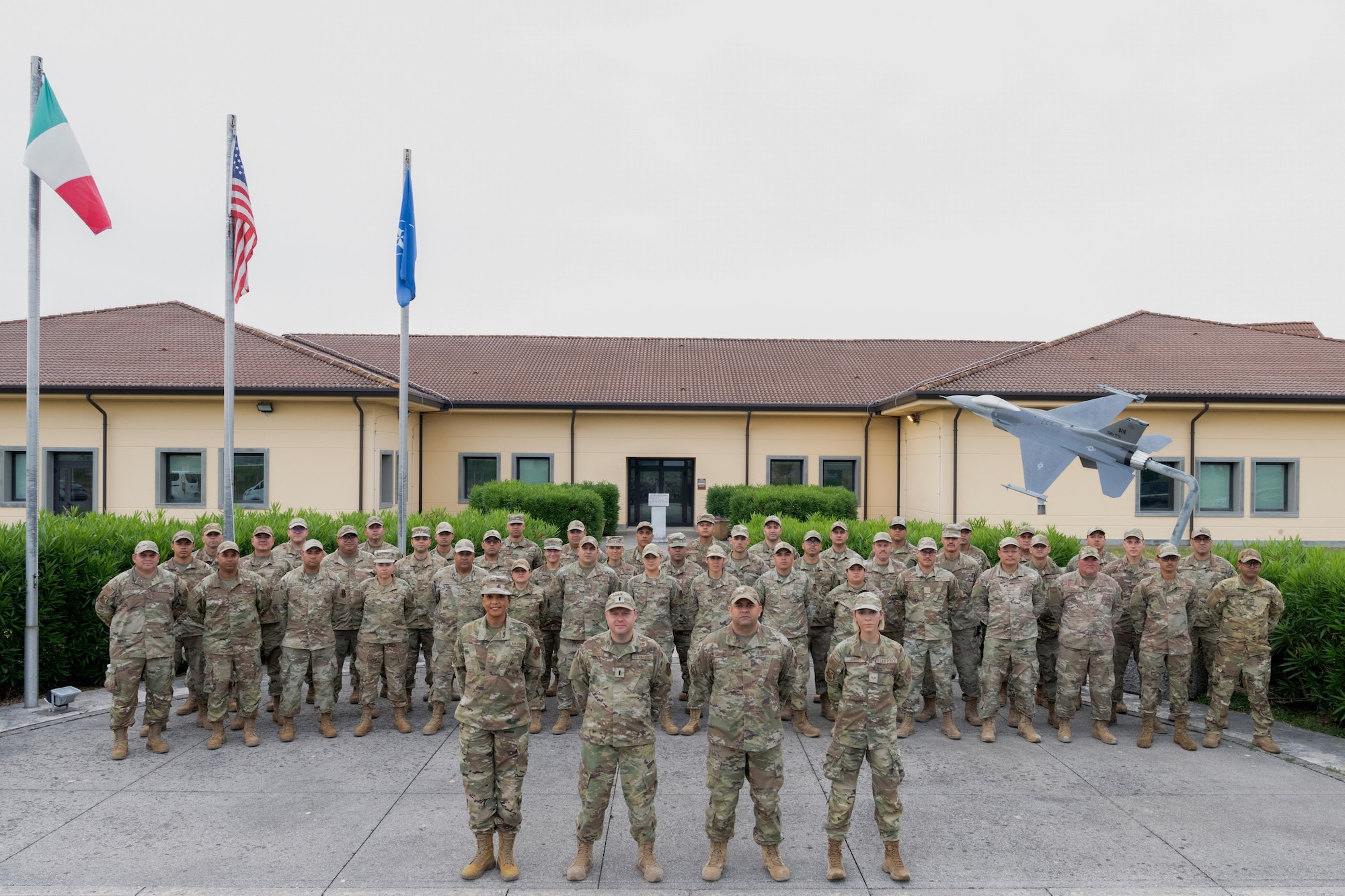 U.S. Airmen assigned to the 156th Civil Engineer Squadron, Puerto Rico Air National Guard, pose for a group photo during a Deployment for Training (DFT) at Aviano Air Base, Italy, June 25, 2025. During the DFT, the 156th CES developed their skill proficiency in a new area of responsibility while supporting real-world projects that support the U.S. European Command operations. (U.S. Air National Guard photo by Senior Airman Victoria Jewett