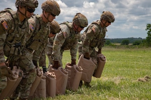 This week kicks off the 1st Infantry Division's Best Squad Competition, May 27-30, 2025, on Fort Riley, KS. The M4 stress shoot involved completing strenuous physical squad-based tasks, while ensuring targets could still be hit downrange. (U.S. Army photos by Sgt. Tyler Selige)