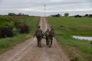 This week kicks off the 1st Infantry Division's Best Squad Competition, May 27-30, 2025, on Fort Riley, KS. Squads performed tactical combat casualty care after encountering a friendly casualty while on patrol. (U.S. Army photos by Sgt. Tyler Selige)