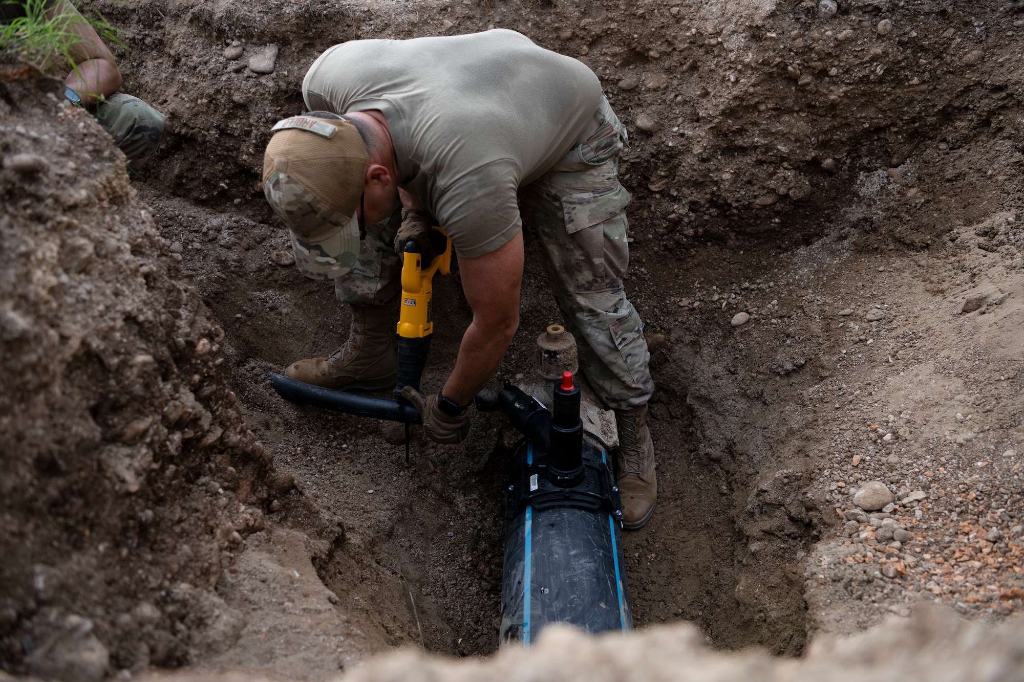 U.S. Air Force Staff Sgt. Juan Arbelo, water and fuels systems journeyman assigned to the 156th Civil Engineer Squadron, Puerto Rico Air National Guard, replaces and repairs main portable water system during a Deployment for Training (DFT) at Aviano Air Base, Italy, June 24, 2025. During the DFT, the 156th CES developed their skill proficiency in a new area of responsibility while supporting real-world projects that support the U.S. European Command operations. (U.S. Air National Guard photo by Senior Airman Victoria Jewett)