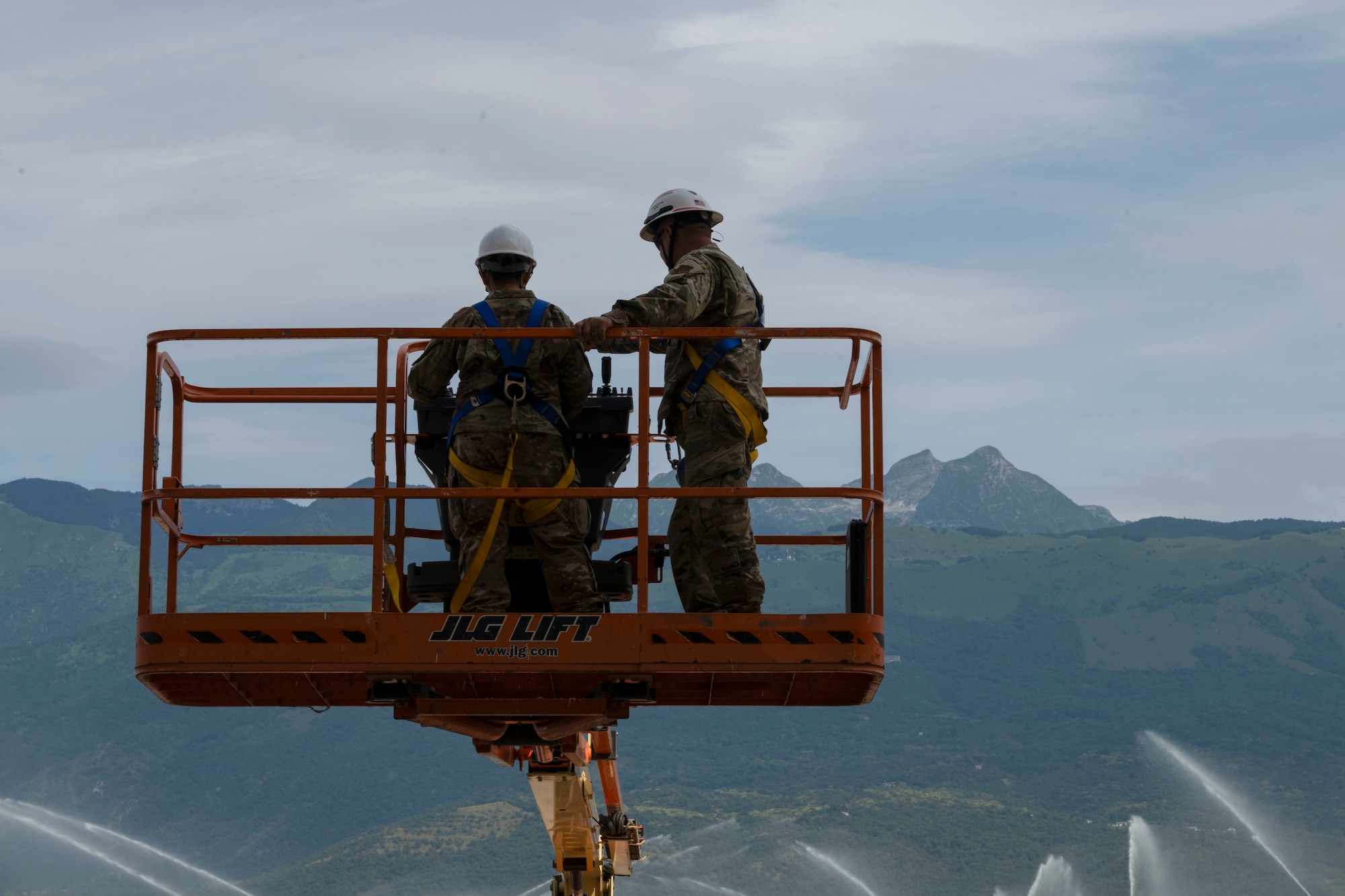 U.S. Airmen assigned to the 156th Civil Engineer Squadron, Puerto Rico Air National Guard, operate a boom lift during a Deployment for Training (DFT) at Aviano Air Base, Italy, June 17, 2025. During the DFT, the 156th CES developed their skill proficiency in a new area of responsibility while supporting real-world projects that support the U.S. European Command operations. (U.S. Air National Guard photo by Senior Airman Victoria Jewett)