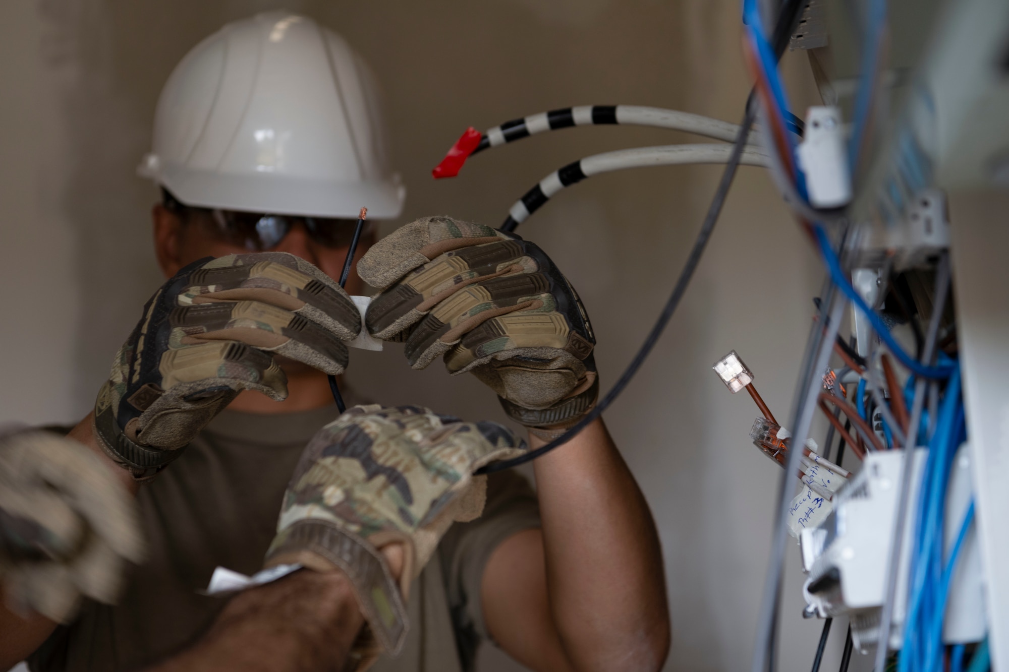 U.S. Airman assigned to the 156th Civil Engineer Squadron, Puerto Rico Air National Guard, rewires a building’s electrical system during a Deployment for Training (DFT) at Aviano Air Base, Italy, June 23, 2025. During the DFT, the 156th CES developed their skill proficiency in a new area of responsibility while supporting real-world projects that support the U.S. European Command operations. (U.S. Air National Guard photo by Senior Airman Victoria Jewett)
