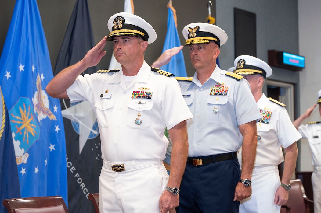 Capt. George Howell, left, relieves Rear Adm. Little, right, as Director of Joint Interagency Task Force-West during a change of command ceremony at Camp H.M. Smith in Honolulu, July 2, 2025.