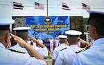 U.S. Navy and Royal Thai Navy leaders salute a formation of U.S. and Thai service members during the opening ceremony of exercise Cooperation Afloat Readiness and Training (CARAT) at Sattahip Naval Base, Thailand, July 7, 2025. The 31st iteration of CARAT, a multinational exercise series, is designed to enhance the U.S. and partner navies' abilities to operate together in response to traditional and non-traditional maritime security challenges in the Indo-Pacific region. (U.S. Air Force photo by Staff Sgt. Destani Hill)
