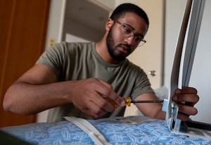 A U.S. Air Force Airman assigned to the 35th Fighter Wing (FW) assembles a portable air conditioning unit frame tobe installed in a contingency dormitory for Exercise Resolute Force Pacific (REFORPAC) at Misawa Air Base, Japan, July 2, 2025. This infrastructure upgrade will support a surge of more than 1,000 inbound service members for REFORPAC, enabling the 35th FW to maintain mission readiness under high-tempo conditions. (U.S. Air Force photo by Senior Airman Brittany Russell)