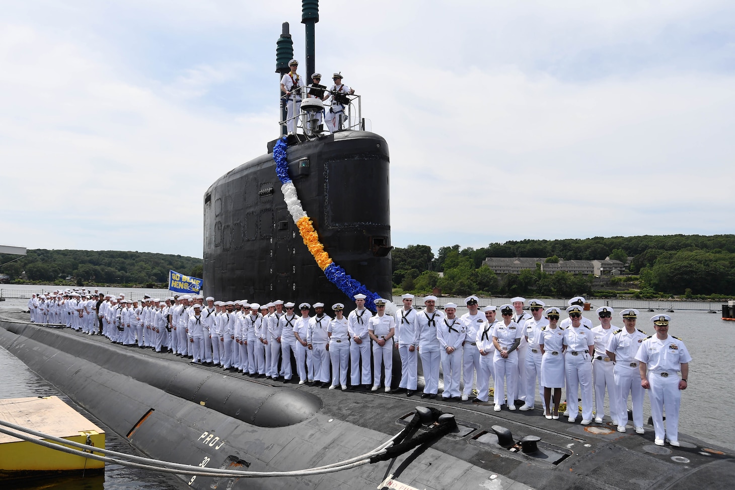 250705-N-ME988-1492 NAVAL SUBMARINE BASE NEW LONDON, Conn. (July 5, 2025) The crew of the Virginia-class fast-attack submarine USS Delaware (SSN 791) gathers top-side for a command photo as the boat returns to Naval Submarine Base New London, Conn., July 5, 2025, following a six-month deployment to the U.S. European Command area of responsibility. Delaware and crew operate under Submarine Squadron (SUBRON) 12, whose primary mission is to provide fast-attack submarines that are ready, prepared, and committed to meet the unique challenges of undersea combat and deployed operations in unforgiving environments across the globe. (U.S. Navy photo by Chief Mass Communication Specialist Darren M. Moore)