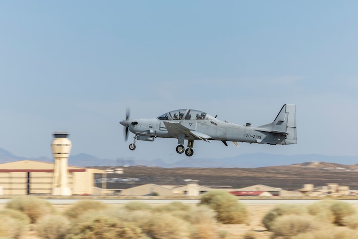 Instructors at Air Force Test Pilot School depart Edwards Air Force Base in California during an A-29C training flight. The A-29C Super Tucano fleet has begun formal integration into school's curriculum. This new aircraft provides students with a modern platform for instruction in aerial spins, sensors and mission systems training, while also giving the school an additional aircraft type for data collection during research projects. (Air Force photo by James West)