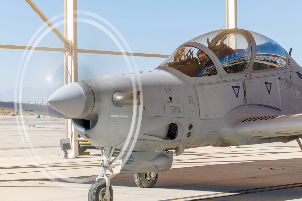 Major Mateusz Borek, flight sciences assistant department chair and chief A-29 test pilot for the Air Force Test Pilot School, prepares for a training sortie at Edwards Air Force Base, California. The A-29C Super Tucano fleet has begun formal integration into school's curriculum. This new aircraft provides students with a modern platform for instruction in aerial spins, sensors and mission systems training, while also giving the school an additional aircraft type for data collection during research projects. (Air Force photo by Jennifer Healy)