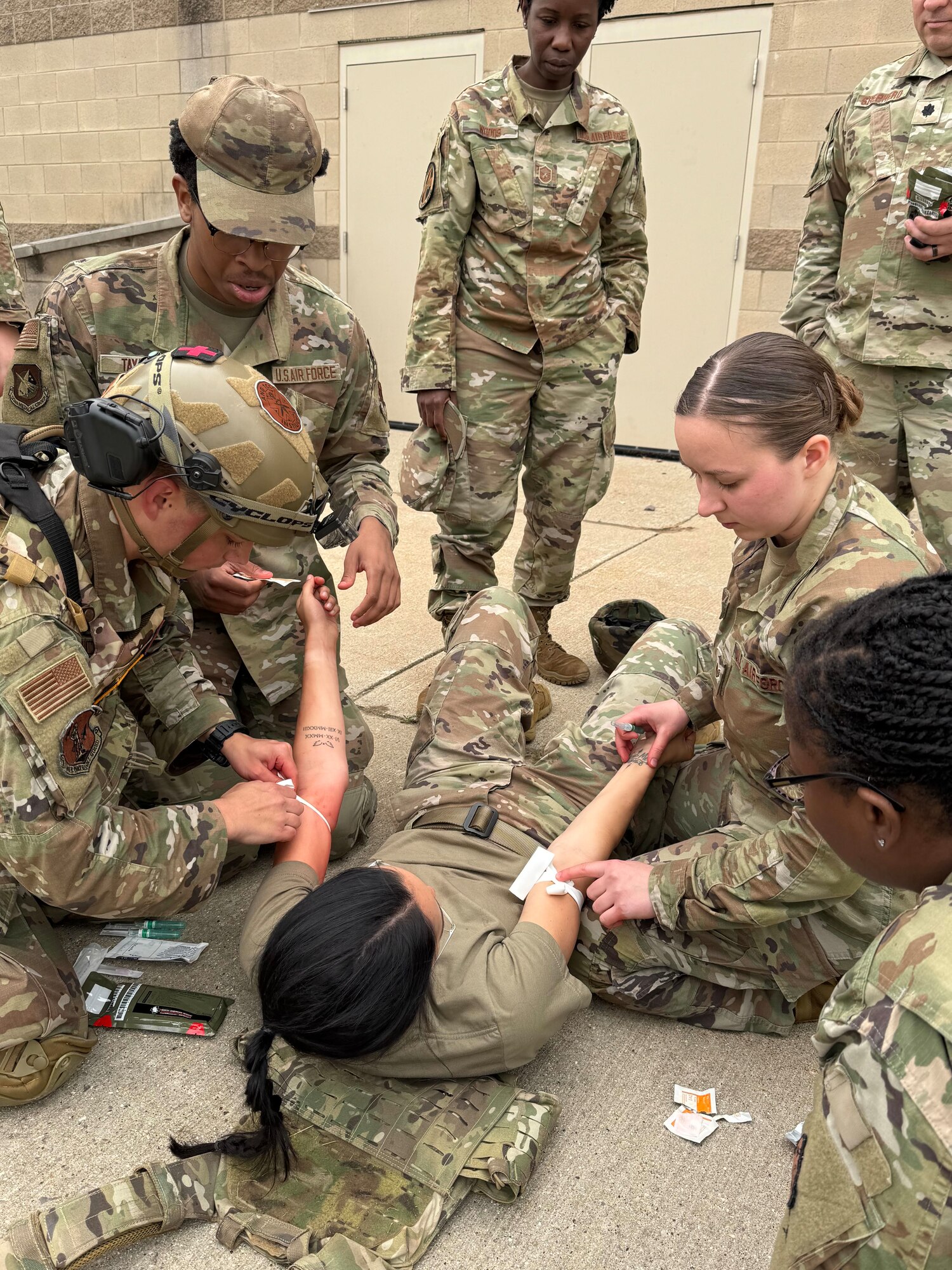 Air National Guard Airmen conduct Tactical Combat Casualty Care (TCCC) Tier 2 training at Alpena Combat Readiness Training Center, Michigan, June 2025.