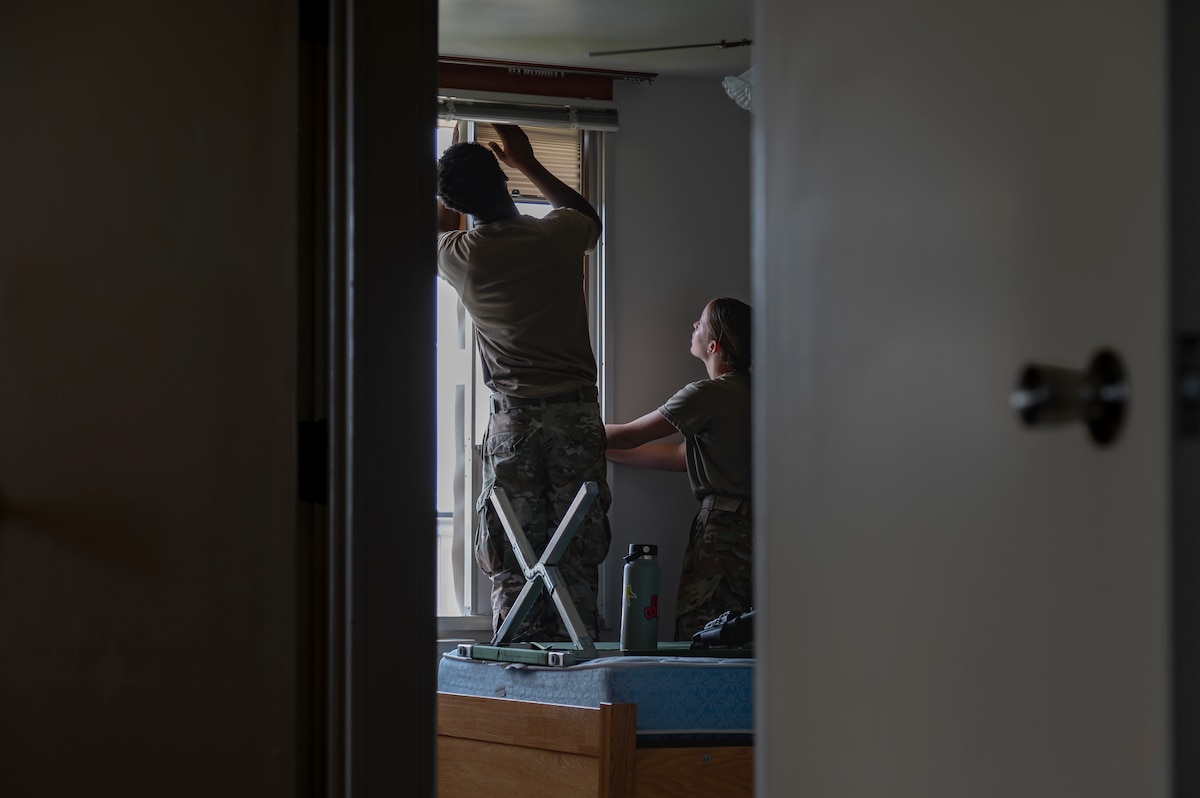 U.S. Air Force Airmen assigned to the 35th Fighter Wing install a portable air conditioning unit in a contingency dormitory for Exercise Resolute Force Pacific (REFORPAC) at Misawa Air Base, Japan, July 2, 2025. Facility improvements ensure operational forces remain agile, responsive and ready to meet critical mission demands for REFORPAC and throughout the Indo-Pacific theater. (U.S. Air Force photo by Senior Airman Brittany Russell)