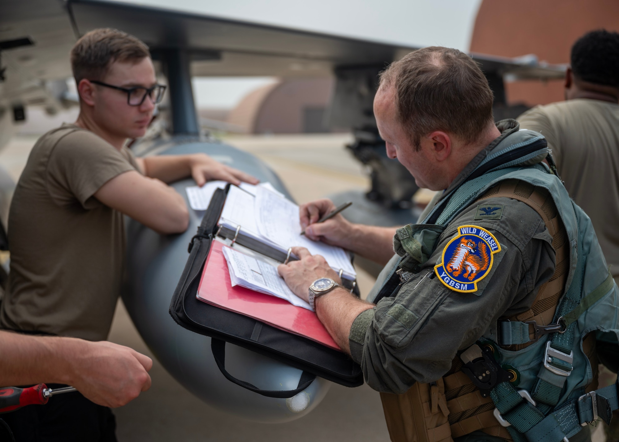 U.S. Air Force Col. Matt Kenkel, 35th Fighter Wing deputy commander, signs transfer documents at Osan Air Base, Republic of Korea, June 26, 2025. The arrival of the F-16s at Osan strengthened the airpower capabilities across the Indo-Pacific and increased the U.S. military’s ability to respond swiftly and effectively to threats. (U.S. Air Force photo by Staff Sgt. Sarah Williams)