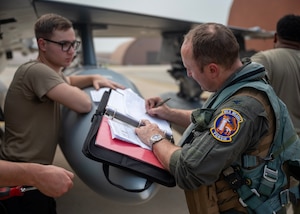 U.S. Air Force Col. Matt Kenkel, 35th Fighter Wing deputy commander, signs transfer documents at Osan Air Base, Republic of Korea, June 26, 2025. The arrival of the F-16s at Osan strengthened the airpower capabilities across the Indo-Pacific and increased the U.S. military’s ability to respond swiftly and effectively to threats. (U.S. Air Force photo by Staff Sgt. Sarah Williams)