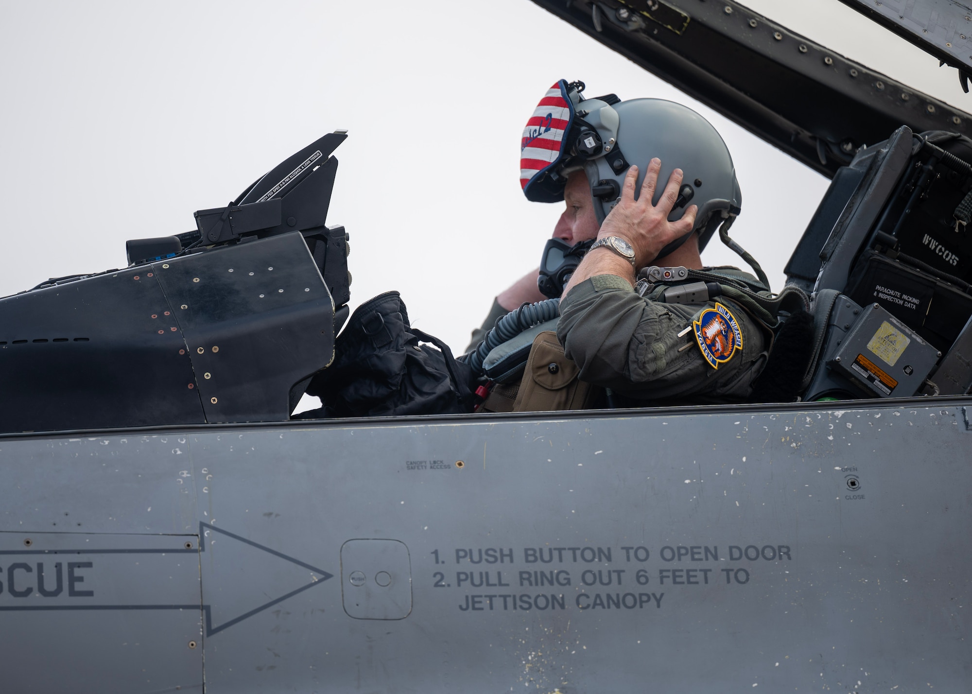 U.S. Air Force Col. Matt Kenkel, 35th Fighter Wing deputy commander, removes his helmet at Osan Air Base, Republic of Korea, June 26, 2025. The arrival of the upgraded F-16 Fighting Falcon on Osan underscored the U.S.-ROK alliance and ensures the wing remains prepared to fight tonight. (U.S. Air Force photo by Staff Sgt. Sarah Williams)