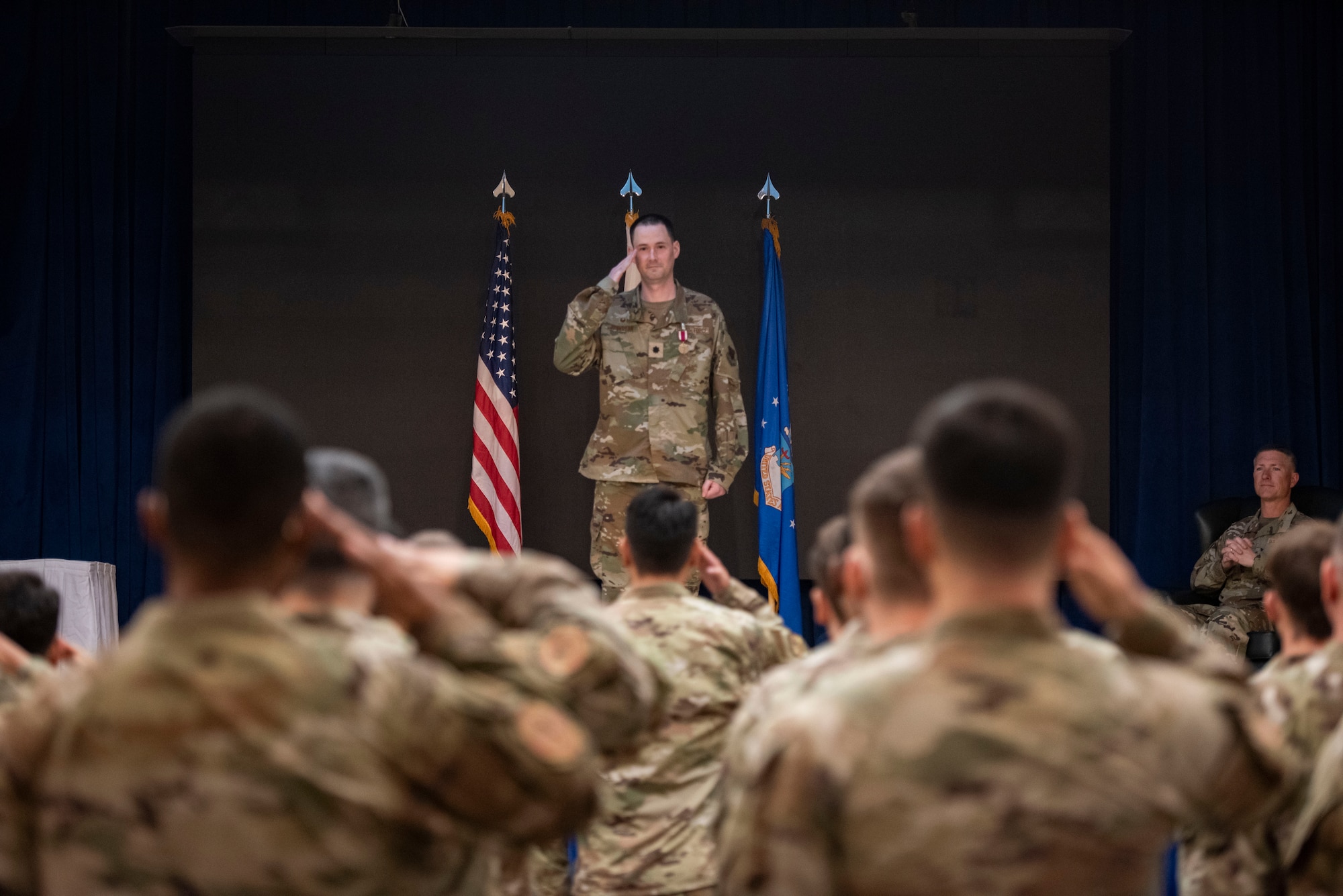 U.S. Air Force Lt. Col. Daniel Johnston, outgoing 694th Intelligence Support Squadron commander, receives his final salute during the 694th ISS Change of Command ceremony at Osan Air Base, Republic of Korea, July 8, 2025.