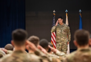 U.S. Air Force Maj. Albert Yin, incoming 694th Intelligence Support Squadron commander, receives his first salute during the 694th ISS Change of Command ceremony at Osan Air Base, Republic of Korea, July 8, 2025.