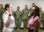 Dr. Andrea Karsten (right) commissions as a Navy psychiatric officer