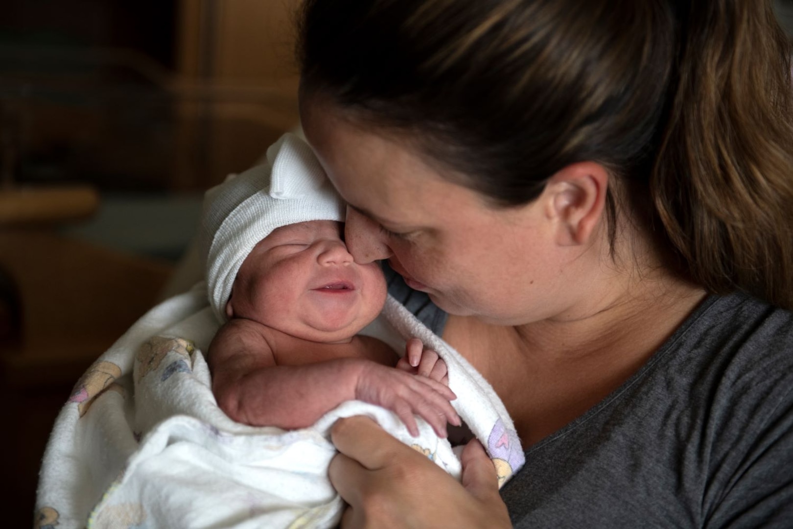Mother holds newborn baby