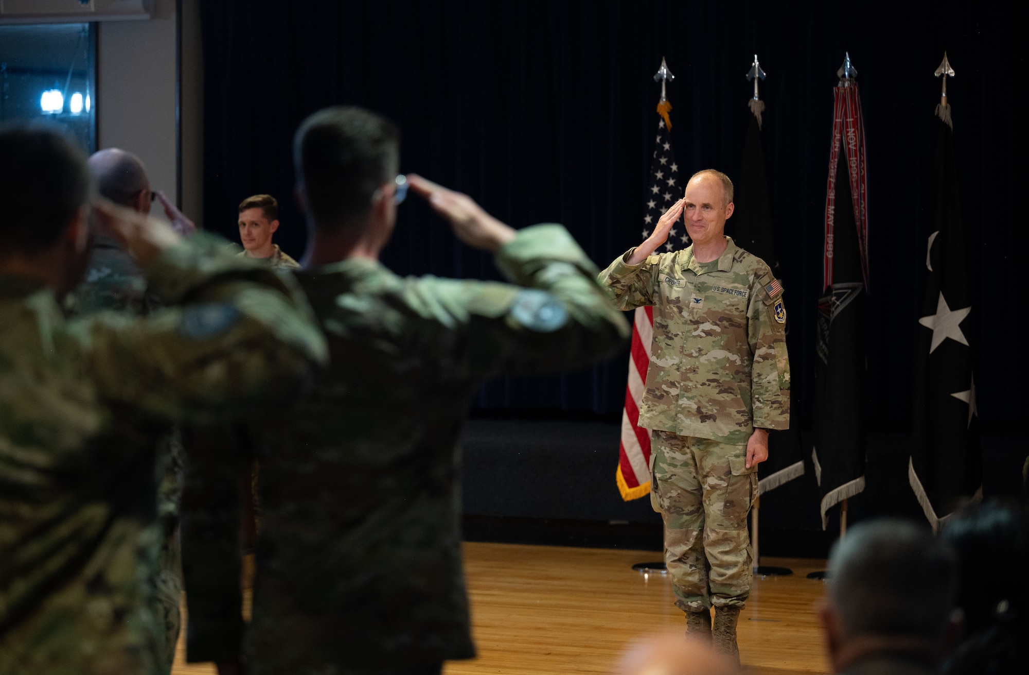 U.S. Space Force Barry Coker receives his first salute from members of Mission Delta 2 following his acceptance of command during a change-of-command ceremony, July 3, 2025, at Peterson SFB, Colo. MD2 conducts Space Domain Awareness (SDA) operations to identify, characterize, and exploit opportunities and mitigate vulnerabilities in the national security space terrain on behalf of the United States Space Force and United States Space Command.