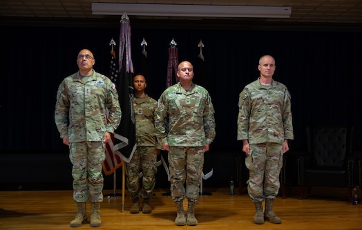  U.S. Space Force Lt. Gen. David N. Miller, Jr., commander of Space Operations Command, U.S. Space Force Col. Raj Agrawal and U.S. Space Force Barry Coker stand at attention as Col. Agrawal prepares to relinquish command of Mission Delta 2 to Col. Croker during a change-of-command ceremony, July 3, 2025, at Peterson SFB, Colo. MD2 conducts Space Domain Awareness (SDA) operations to identify, characterize, and exploit opportunities and mitigate vulnerabilities in the national security space terrain on behalf of the United States Space Force and United States Space Command.