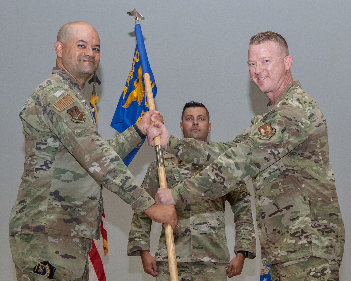 Haselden hands guidon to Harris
