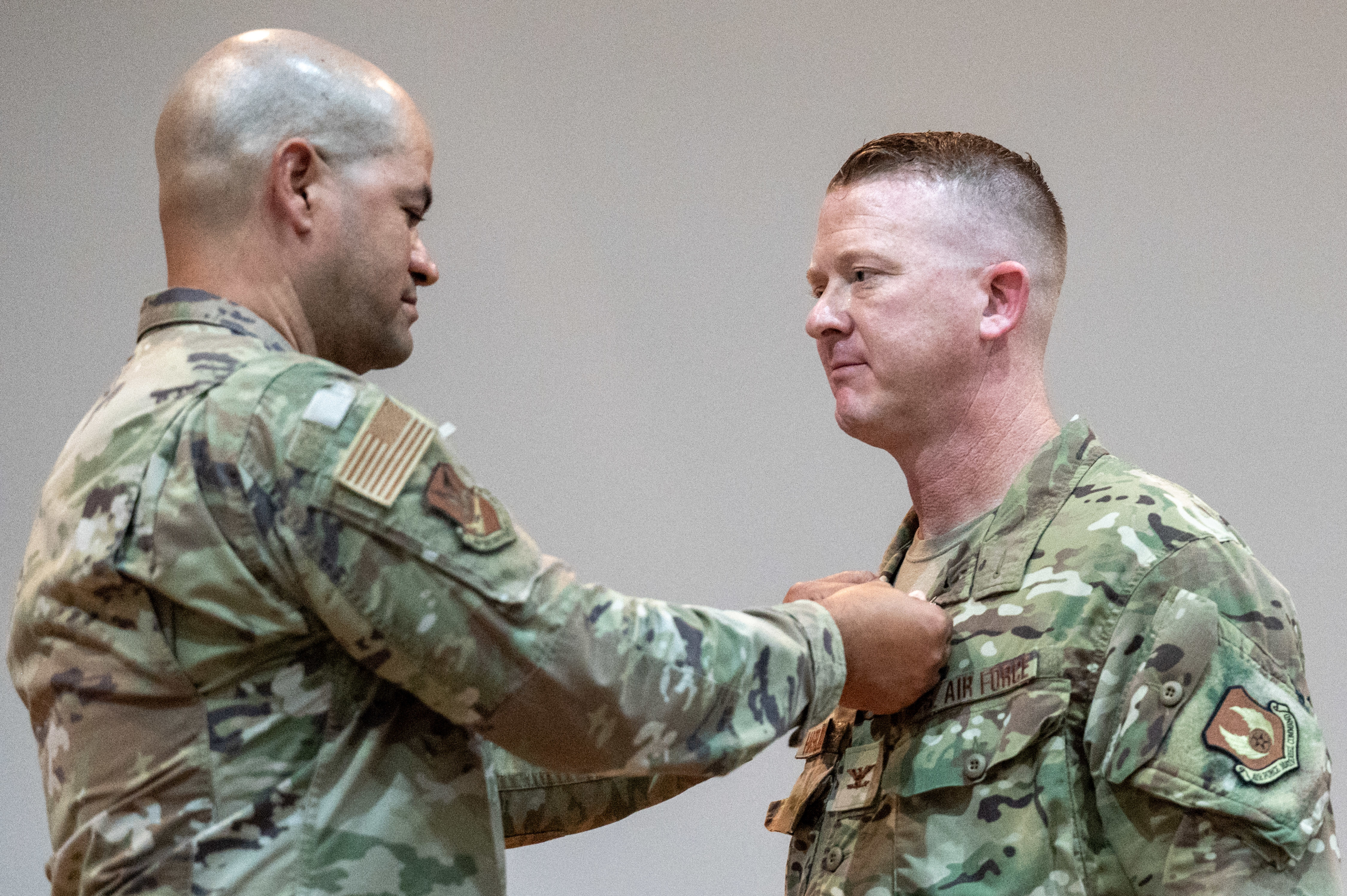 Col. Scott Haselden, 570th Combat Training Squadron commander, right, receives the Meritorious Service Medal from Air Force Col. Jason Harris, Air Force Security Forces Center commander, during a change of command ceremony at Fort Bliss, Texas, June 27, 2025. The 570th CTS was activated in 2024, with Haselden leading more than 180 detachment personnel through the transition from a detachment to a squadron. (U.S. Air Force photo by Senior Airman Bob Teichmann)