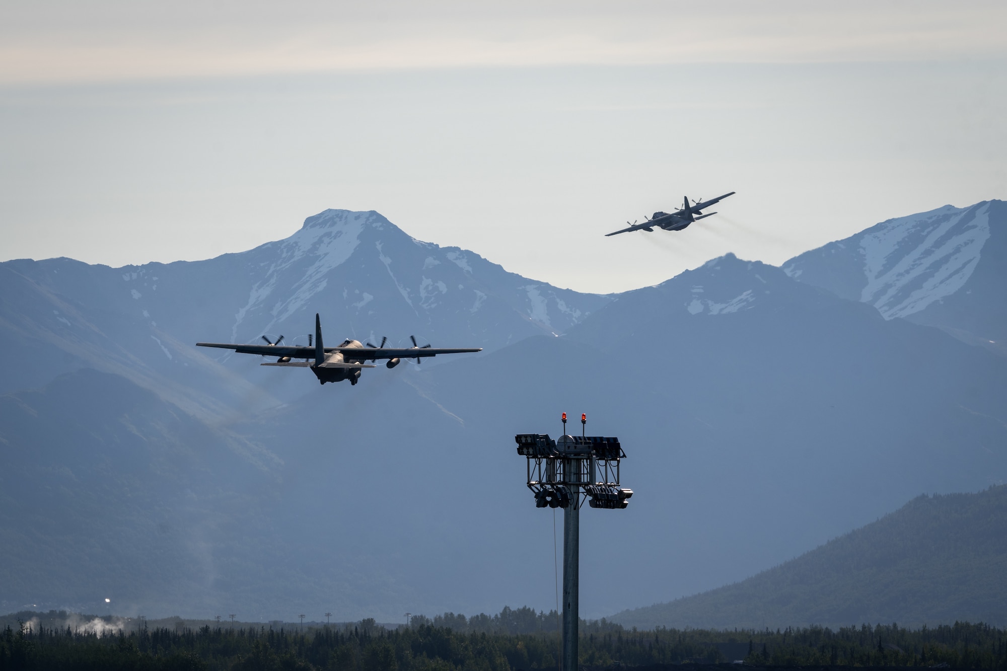 Two JASDF aircraft perform aerial operations.
