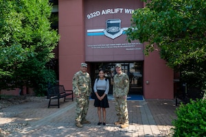 Jenn Atanasov (center), Office of the Senator Tammy Duckworth metro east community outreach coordinator, poses for a photo with Col. Jeffrey Smith 932nd Airlift Wing commander (left) and Col. Rick Chadwick (right), 932nd AW deputy commander in front of the 932nd AW headquarters building upon the conclusion of her visit, Scott AFB, Illinois, June 11, 2025.  Atanasov represents Senator Tammy Duckworth, a U.S. Senator from Illinois who was elected to the Senate in 2016 after serving two terms as a U.S. House of Representatives congresswoman from 2012 to 2016.