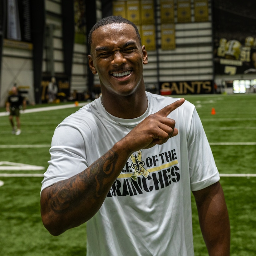 U.S. Marine Corps Cpl. Trakeci Cooper, a distribution specialist with Headquarters Battalion, Marine Forces Reserve, poses for a photo after winning the 40-yard dash competition for the Marines in the Battle of The Branches at the New Orleans Saints Practice Facility, Metairie, Louisiana, July 1, 2025. Battle of The Branches consisted of multiple events, the event consisted of flag football, tug-of-war, 40-yard dash, sprint relay, distance throwing and a push up competition. (U.S. Marine Corps photo by Cpl. Aaron TorresLemus)