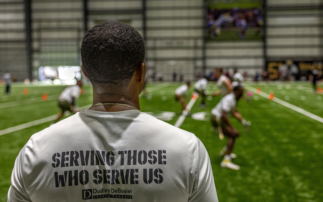 U.S. Marines with Marine Forces Reserve and Marine Forces South, pose for a group photo in the endzone after the Battle of The Branches at the New Orleans Saints Practice Facility, Metairie, Louisiana, July 1, 2025. The New Orleans Saints hosted the Battle of The Branches for service members from all branches in the U.S. military to come together to participate in a friendly competition. (U.S. Marine Corps photo by Cpl. Aaron TorresLemus)
