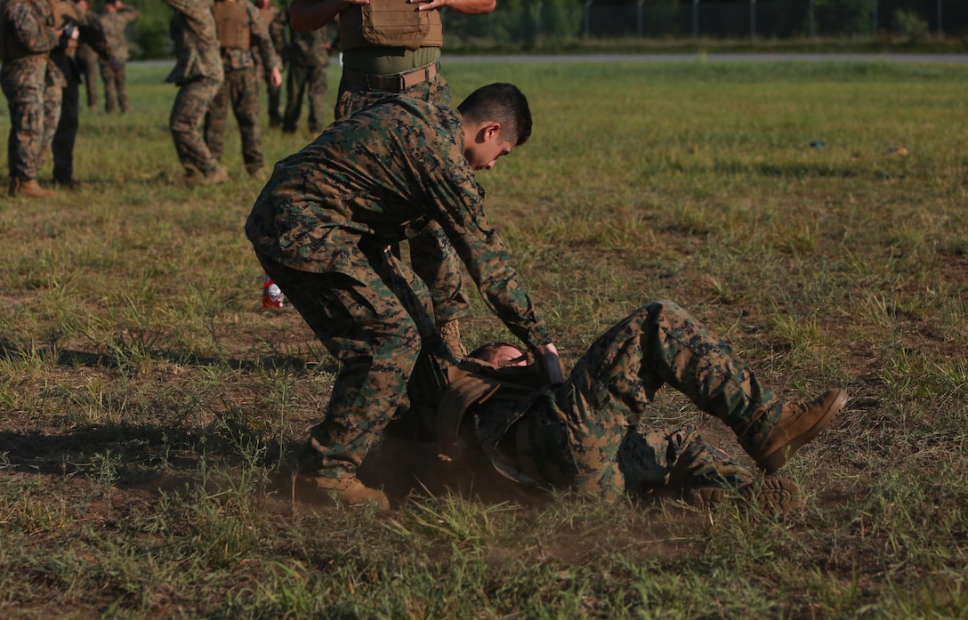 U.S. Marine Corps PFC Tomas Villanueva (top) and Cpl. Aaron Sowell (bottom) conduct a Marine Corps Martial Arts Program (MCMAP) course during Atlantic Alliance '25 (AA25) on July 6, 2025.

AA25 maintains Marine Corps capabilities while implementing ground support training such as MCMAP qualifications.

(U.S. Marine Corps photo by LCpl. Kenneth Lambert)