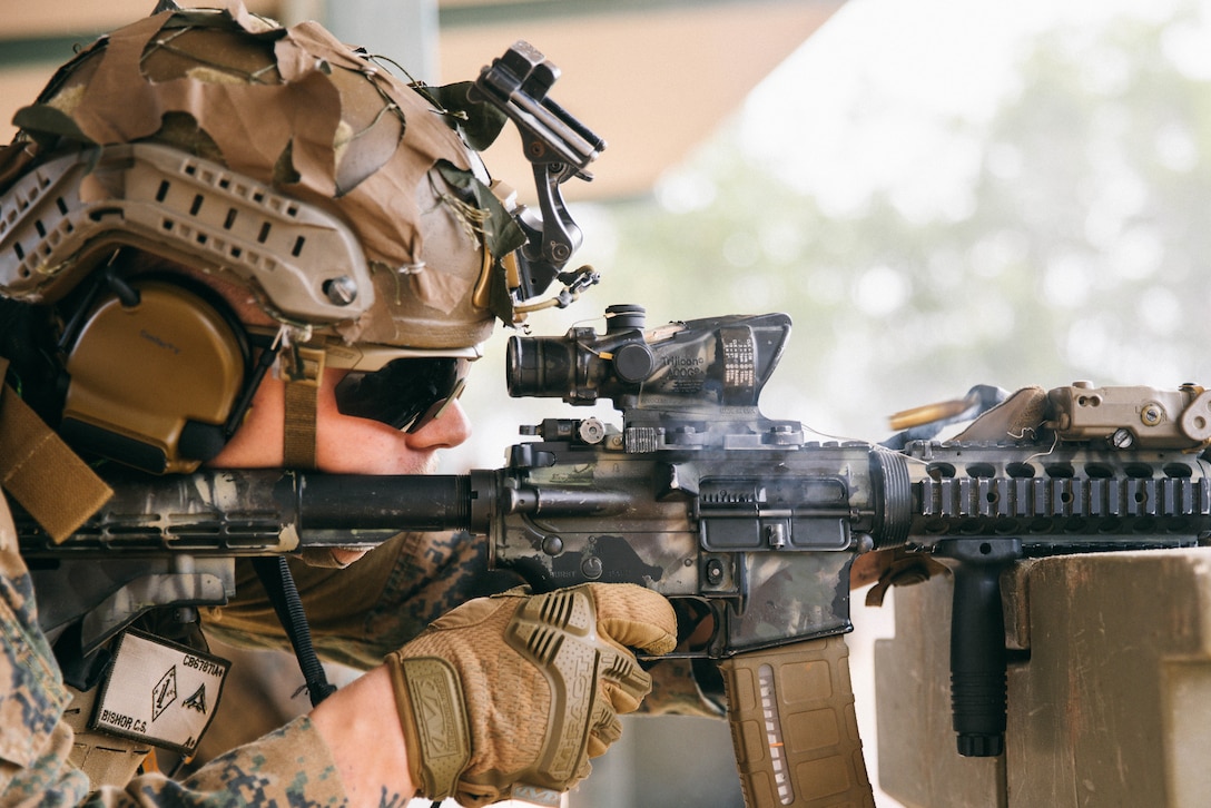 U.S. Marine Corps Lance Cpl. Cayden Bishop, a rifleman with Headquarters Company, Marine Rotational Force – Darwin 25.3, fires an M4 carbine during an unknown-distance combat marksmanship range at Robertson Barracks, Darwin, Australia, July 2, 2025.