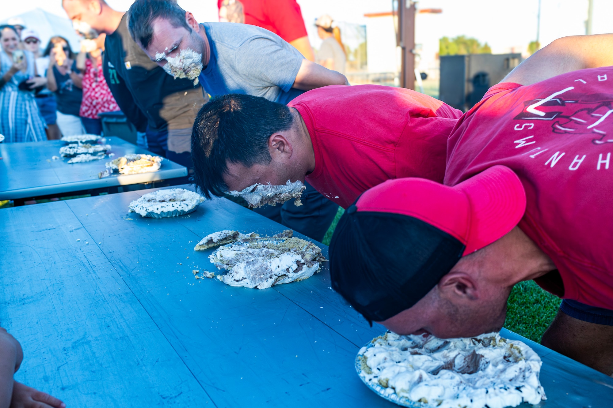 Airmen compete at the pie-eating contest during Summer Bash, July 4. (Air Force photo by Giancarlo Casem)