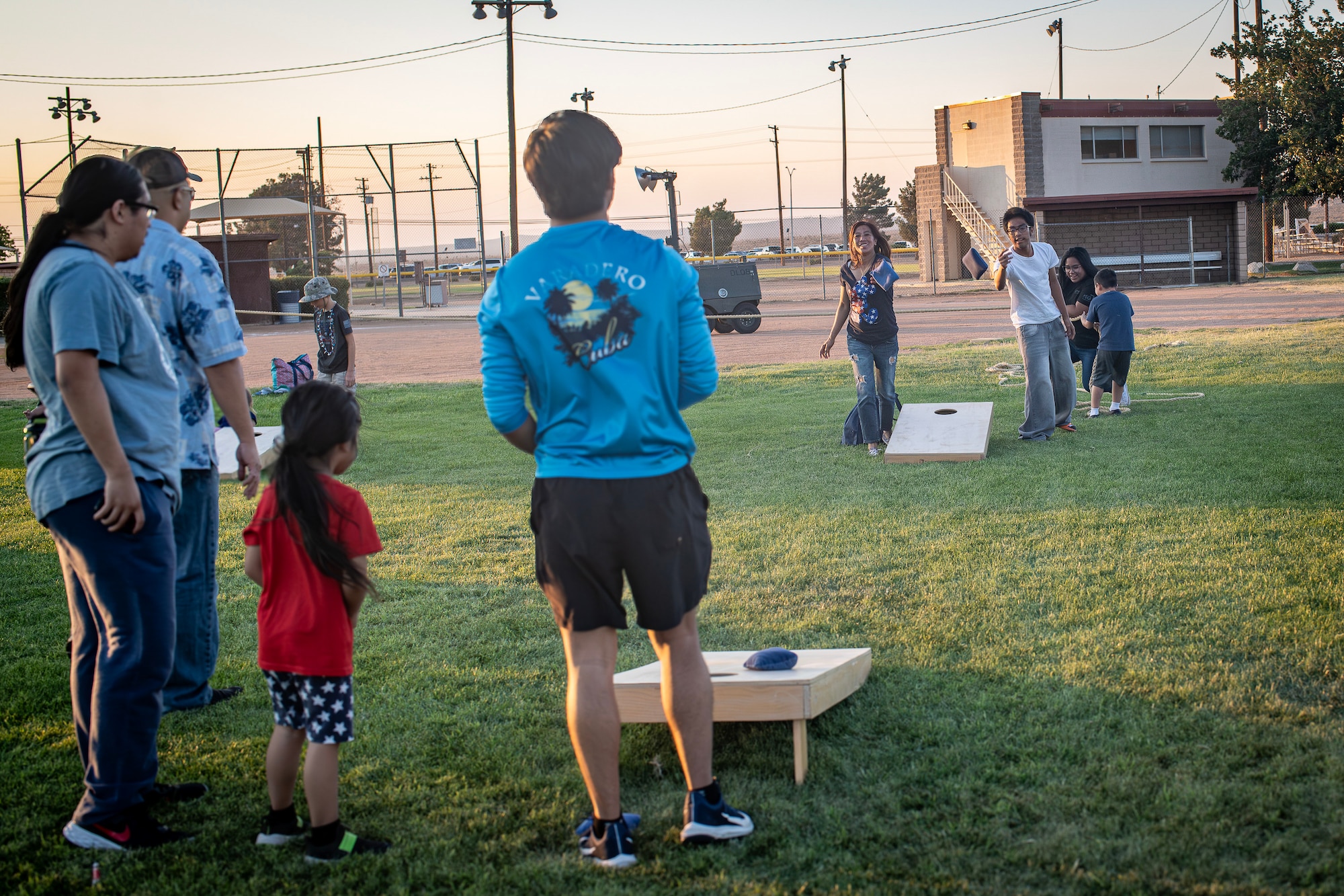 Edwards family members play a game of cornhole during the annual Summer Bash hosted by the 412th Force Support Squadron on Edwards Air Force Base, July 4. (Air Force photo by Giancarlo Casem)